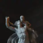 Une statue d'un homme et d'une femme dans une pièce sombre et hypnotique, racontant une histoire intrigante.
